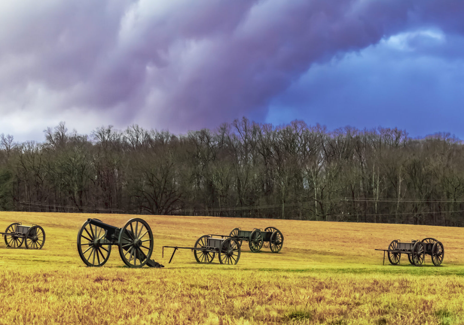 Storm clouds gather over a Civil War battlefield.